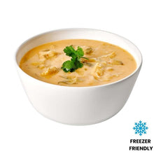 Load image into Gallery viewer, Bowl of Thai Creamy Chicken soup with a sprig of parsley on a white background, featuring a 'Freezer Friendly' label.