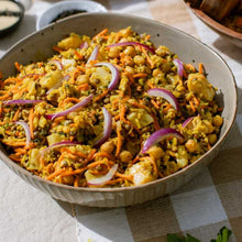 Load image into Gallery viewer, Bowl of vegetable salad with carrots, onions, and chickpeas on a checkered tablecloth.