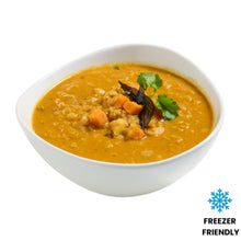 Load image into Gallery viewer, bowl of dahl with carrots and greens on a white background
