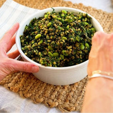 Load image into Gallery viewer, Edamame, Freekeh & Kale Salad in white bowl on table