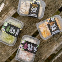 Load image into Gallery viewer, Plastic containers of salad servings with 'Lunch Rush' branding on a wooden surface.