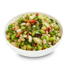 Load image into Gallery viewer, A bowl of Mediterranean chickpea salad, featuring a mix of beans, edamame, roasted capsicum, artichoke, and other vegetables, garnished with herbs.