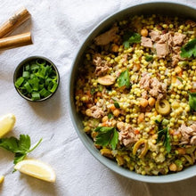Load image into Gallery viewer, Salad with tuna, olives, and green onions on a white tablecloth