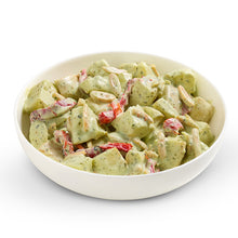 Load image into Gallery viewer, A bowl of potato salad with basil mayonnaise and almonds.