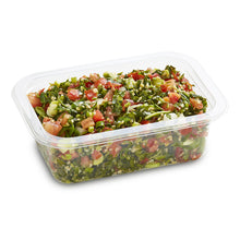 Load image into Gallery viewer, A clear plastic container filled with Tabbouleh Salad, consisting of chopped parsley, shallots, tomato, cucumber, and bulghur wheat, dressed in a lemon vinaigrette.