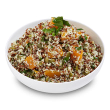 Load image into Gallery viewer, A bowl of Thai Pumpkin Quinoa Salad with visible pieces of pumpkin, quinoa, and herbs.