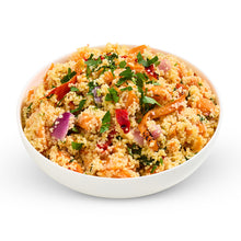 Load image into Gallery viewer, A bowl of roasted vegetable couscous salad with herbs and a dressing, served on a white plate.