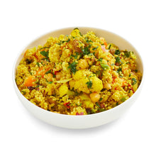 Load image into Gallery viewer, A bowl of sweet potato and cauliflower moroccan couscous salad with visible chickpeas and garnished with herbs.