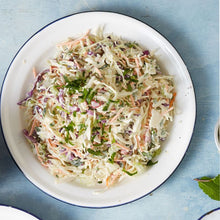 Load image into Gallery viewer, Creamy Coleslaw salad served on a white round plate garnished with chopped coriander