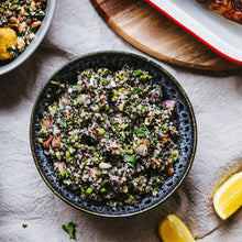 Load image into Gallery viewer, A round blue bowl of Quinoa Tabbouleh salad
