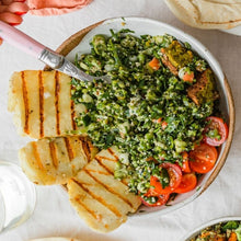 Load image into Gallery viewer, A bowl of Tabbouleh with cherry tomatoes halved, grilled halloumi cheese and bits of falafel