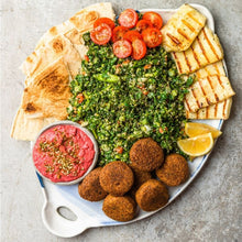 Load image into Gallery viewer, A mezze plate of Tabbouleh, falafels, dip, lemon wedges, tomatoes and flat bread