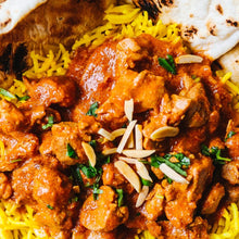Load image into Gallery viewer, Butter chicken with saffron basmati rice garnished with parsley and nuts