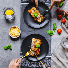 Load image into Gallery viewer, Two plates of baked lasagne on a table