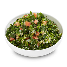 Load image into Gallery viewer, A bowl of Tabbouleh salad, featuring chopped parsley, bulgur wheat, tomatoes, and a dressing, served on a white plate.
