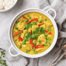 Load image into Gallery viewer, Bowl of creamy mango chicken curry with peas, red capsicum, and fresh coriander.