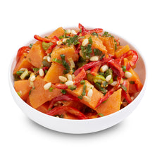 Load image into Gallery viewer, A bowl of roasted sweet potato salad with pine nuts and vegetables, dressed with sesame oil dressing.
