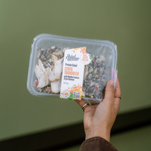 Load image into Gallery viewer, Hand holding a Salad Servers Lentil Tabbouleh with Chicken protein salad.

