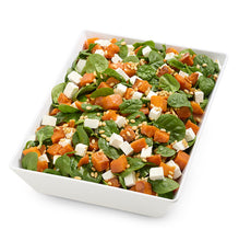 Load image into Gallery viewer, Salad with spinach, sweet potatoes, and feta cheese in a white bowl on a white background
