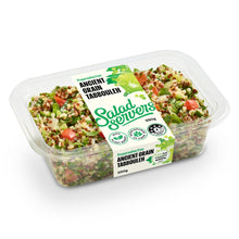 Load image into Gallery viewer, A clear plastic tub of Salad Servers Ancient Grain Tabbouleh salad on a white background.

