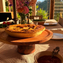 Load image into Gallery viewer, Pie on a wooden stand with a scenic outdoor background
