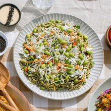 Load image into Gallery viewer, Plated dish of noodles with vegetables on a checkered tablecloth

