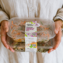 Load image into Gallery viewer, A person in a white button-up shirt holds two clear plastic containers of Saladi Smeraldo Vermicelli pasta salad. The front container has a prominent white paper label with green and purple branding.
