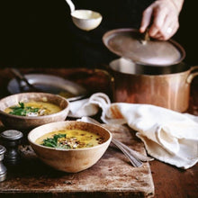 Load image into Gallery viewer, Salad Servers Thai creamy chicken soup in ceramic bowls on stone bench ready to serve
